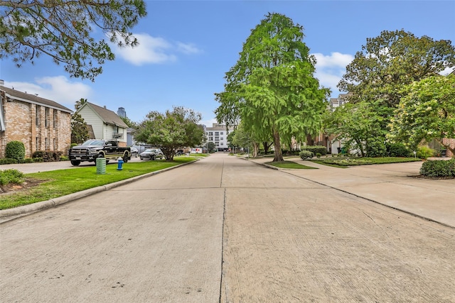 5524 Beverlyhill St Unit 4, Houston, TX 77056 - view of concrete street featuring a residential view and curbs