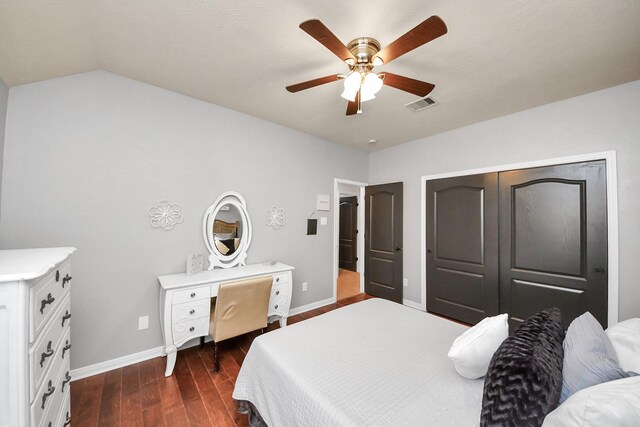 15122 Heron Meadow Ln, Cypress, TX 77429 - bedroom featuring baseboards, dark wood finished floors, ceiling fan, vaulted ceiling, and a closet