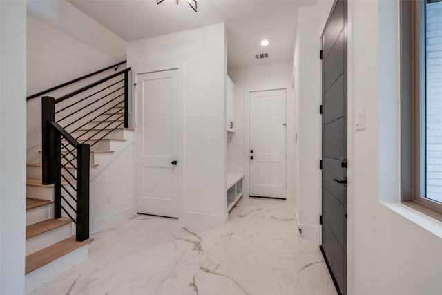 1209 W Bell St, Houston, TX 77019 - hallway featuring baseboards, stairs, light marble finish floors, and recessed lighting