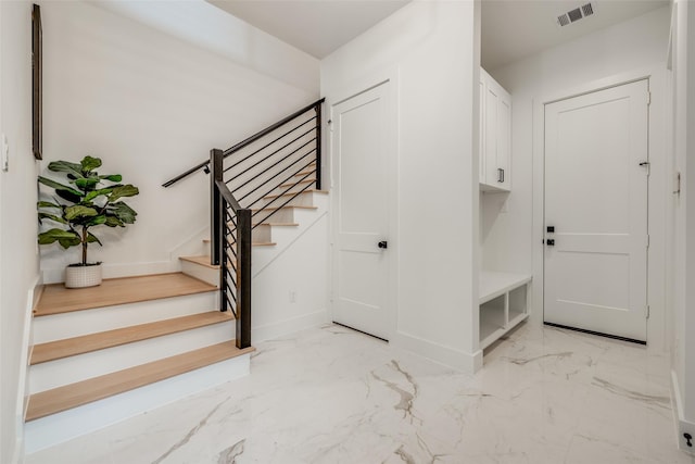 1209 W Bell St, Houston, TX 77019 - mudroom with light marble finish flooring and baseboards