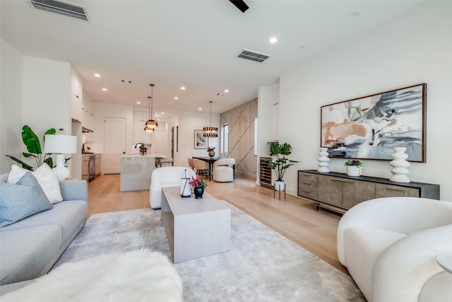 1209 W Bell St, Houston, TX 77019 - living area with light wood finished floors and recessed lighting