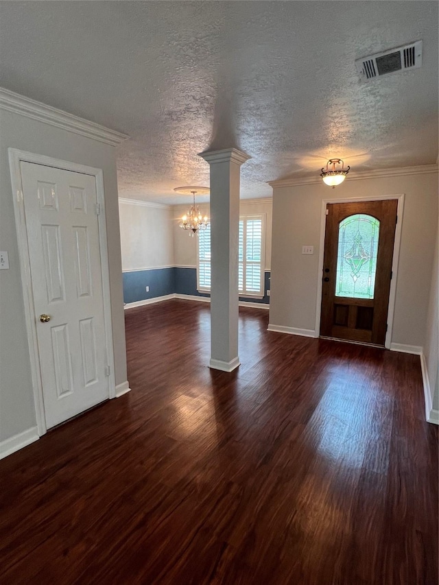 4326 Holly Terrace Ct, Pasadena, TX 77505 - entrance foyer with healthy amount of natural light, a chandelier, dark wood finished floors, ornamental molding, and baseboards