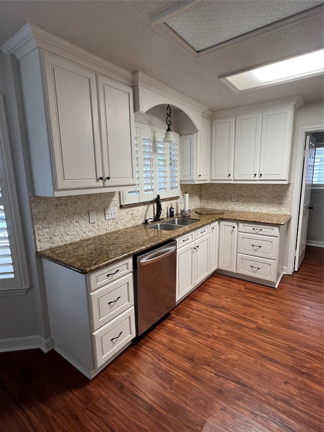 4326 Holly Terrace Ct, Pasadena, TX 77505 - kitchen with stainless steel dishwasher, a sink, white cabinetry, baseboards, and dark wood-style flooring