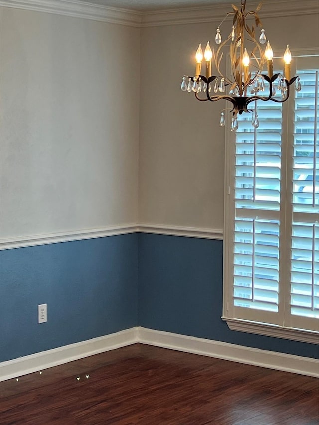 4326 Holly Terrace Ct, Pasadena, TX 77505 - spare room with a chandelier, wood finished floors, baseboards, and ornamental molding