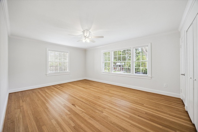 2518 Glen Haven Blvd, Houston, TX 77030 - unfurnished bedroom featuring baseboards, ornamental molding, light wood-style flooring, and a ceiling fan