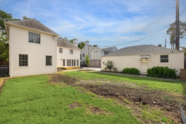2518 Glen Haven Blvd, Houston, TX 77030 - rear view of house with a shingled roof and central air condition unit