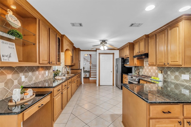 606 Packer Ct, Webster, TX 77598 - kitchen with a sink, stainless steel appliances, dark stone counters, ceiling fan, and open shelves