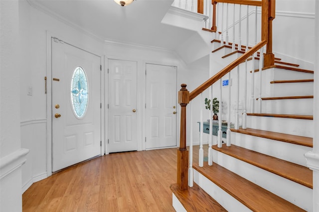 606 Packer Ct, Webster, TX 77598 - entrance foyer featuring stairway, wood finished floors, and ornamental molding