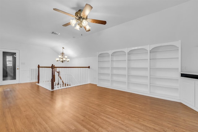 606 Packer Ct, Webster, TX 77598 - empty room featuring light wood finished floors, a chandelier, lofted ceiling, and ceiling fan