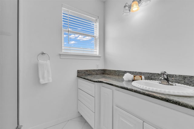606 Packer Ct, Webster, TX 77598 - bathroom featuring tile patterned floors, vanity, and baseboards