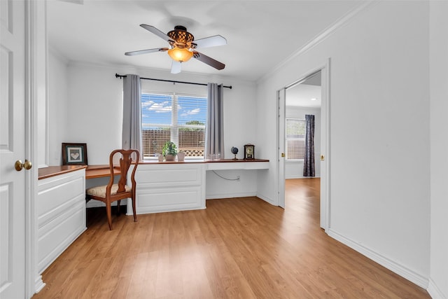 606 Packer Ct, Webster, TX 77598 - office area featuring built in study area, light wood-type flooring, crown molding, a ceiling fan, and baseboards