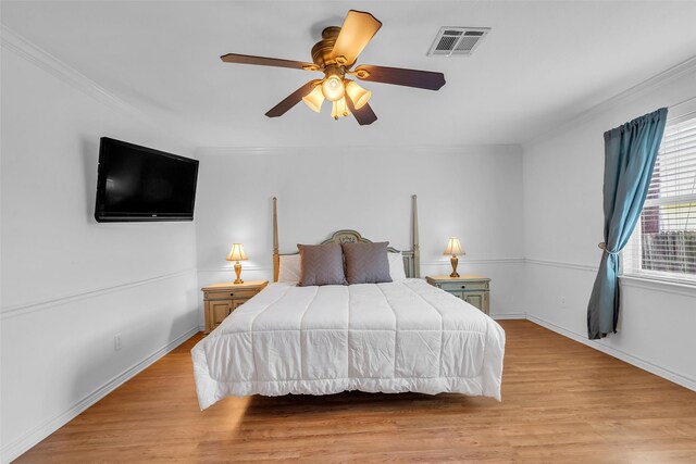 606 Packer Ct, Webster, TX 77598 - bedroom featuring ornamental molding, light wood-type flooring, baseboards, and ceiling fan
