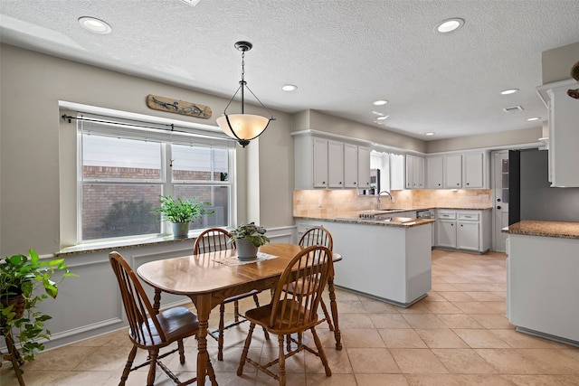 6207 Spring Creek Oaks Dr, Spring, TX 77379 - dining area with a textured ceiling, recessed lighting, and light tile patterned floors