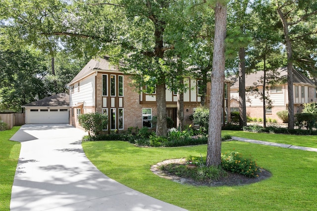 6207 Spring Creek Oaks Dr, Spring, TX 77379 - tudor home with brick siding, a front lawn, a garage, and concrete driveway