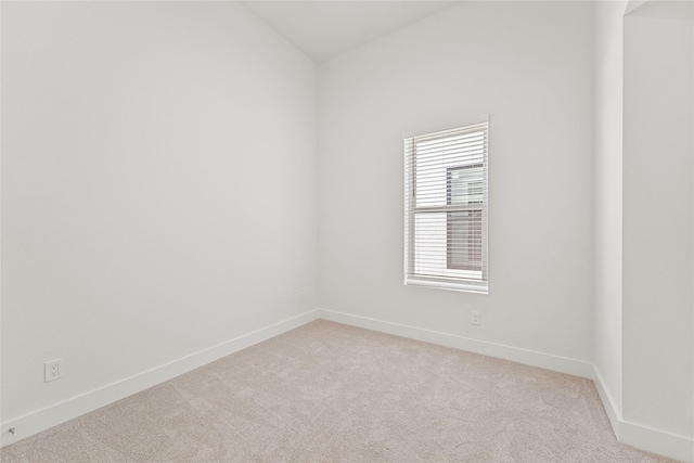 1511 Vermont St Unit A, Houston, TX 77006 - spare room with light carpet, baseboards, and lofted ceiling