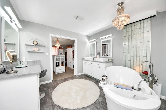 1576 Belle Terre Rd, Huffman, TX 77336 - bathroom featuring a freestanding bath, baseboards, and vanity