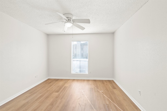 1516 Bay Area Blvd Unit Q1, Houston, TX 77058 - unfurnished room featuring light wood finished floors, ceiling fan, a textured ceiling, and baseboards