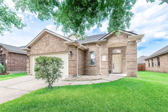 8926 Rollick Dr, Tomball, TX 77375 - view of front of house featuring brick siding, driveway, an attached garage, and a shingled roof