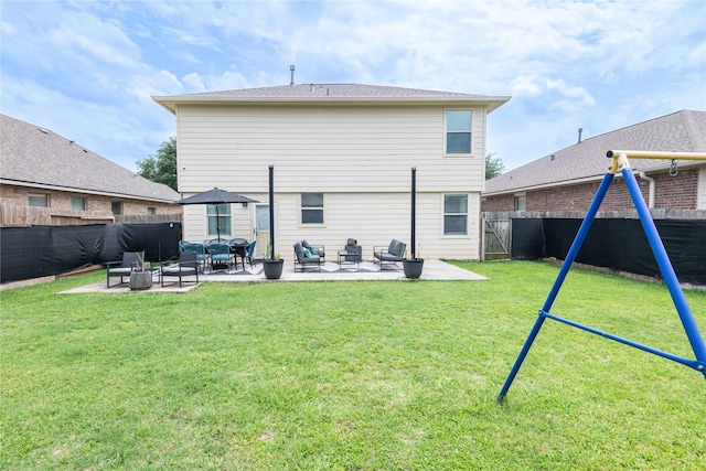 8926 Rollick Dr, Tomball, TX 77375 - back of house featuring a patio area and an outdoor hangout area