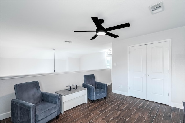8926 Rollick Dr, Tomball, TX 77375 - living area featuring a ceiling fan, baseboards, and dark wood-style floors