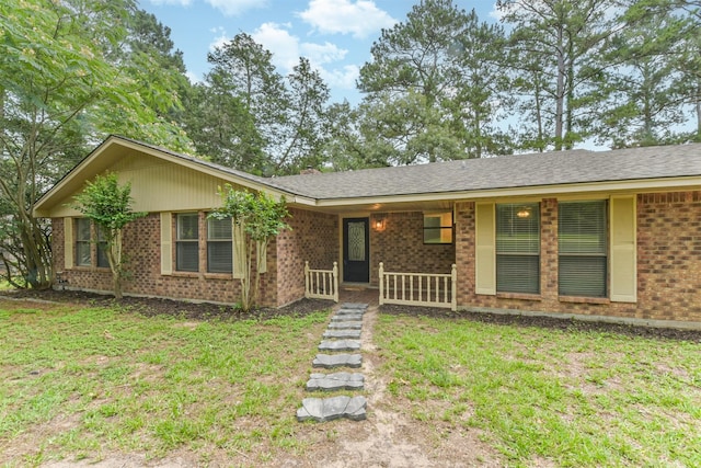 29090 W Lake Dr, Hempstead, TX 77445 - ranch-style home featuring covered porch, brick siding, and a front yard