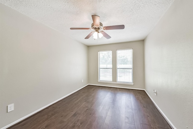 29090 W Lake Dr, Hempstead, TX 77445 - empty room with a textured ceiling, dark wood-style floors, ceiling fan, and baseboards