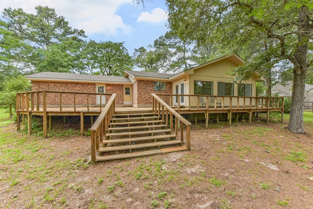 29090 W Lake Dr, Hempstead, TX 77445 - back of house with stairs, a deck, and brick siding