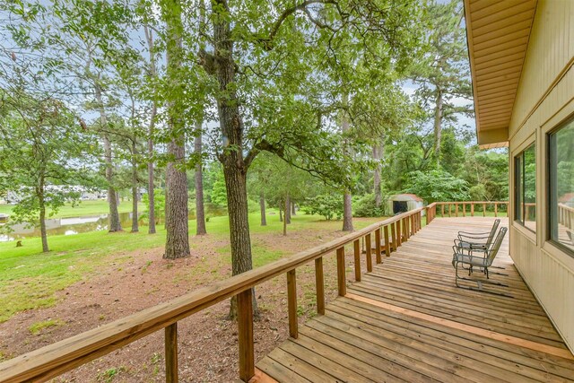 29090 W Lake Dr, Hempstead, TX 77445 - deck featuring a water view and view of wooded area