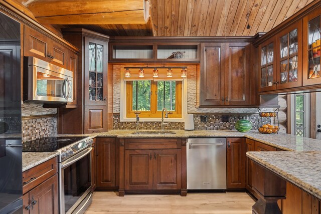 38614 Angel Oaks Dr, Magnolia, TX 77355 - kitchen with stainless steel appliances, a sink, wooden ceiling, decorative backsplash, and healthy amount of natural light