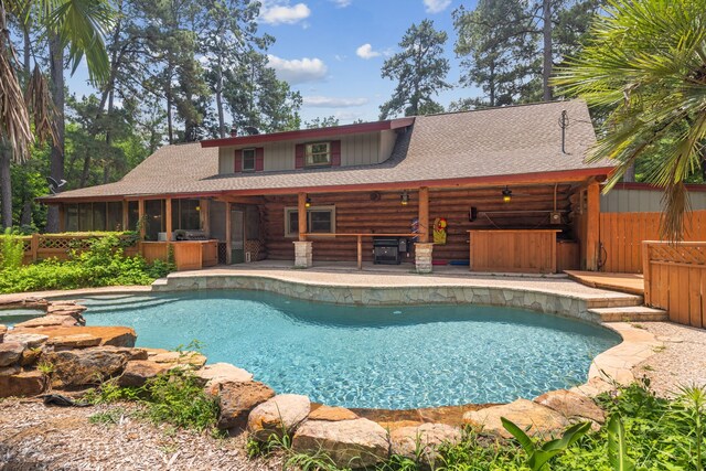 38614 Angel Oaks Dr, Magnolia, TX 77355 - view of pool featuring a patio and a sunroom