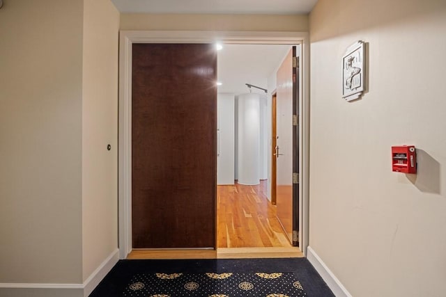 3030 Post Oak Blvd Unit 615, Houston, TX 77056 - hall featuring baseboards and wood finished floors