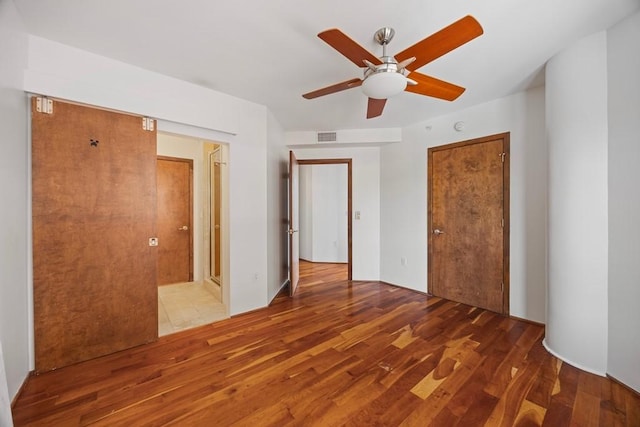3030 Post Oak Blvd Unit 615, Houston, TX 77056 - unfurnished bedroom with wood finished floors and ceiling fan