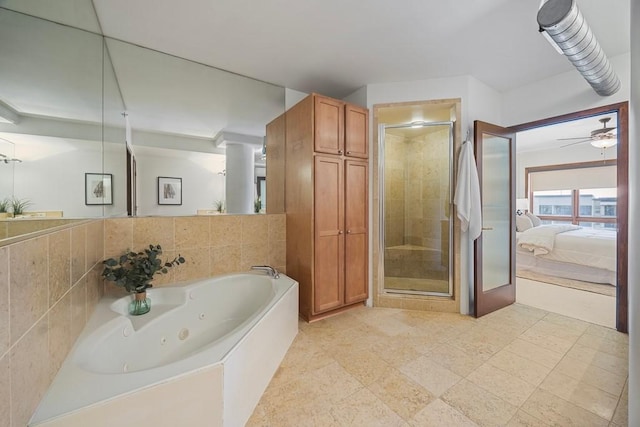 3030 Post Oak Blvd Unit 615, Houston, TX 77056 - full bathroom with a shower stall, ensuite bath, a jetted tub, and ceiling fan