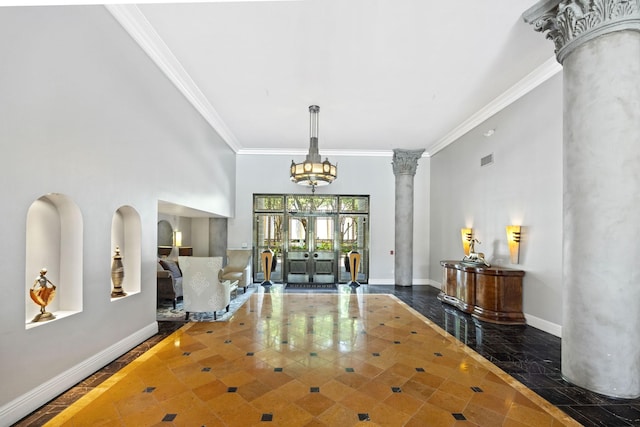 3030 Post Oak Blvd Unit 615, Houston, TX 77056 - entrance foyer with ornamental molding, inlaid floor details, ornate columns, french doors, and a chandelier