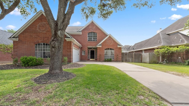9618 Mystic Crossing Ct, Houston, TX 77065 - traditional-style house featuring driveway and brick siding