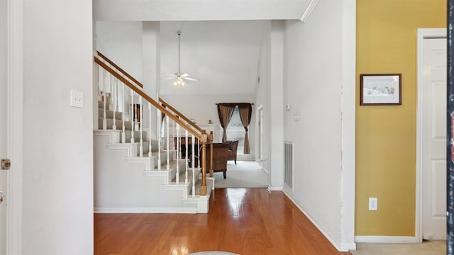 9618 Mystic Crossing Ct, Houston, TX 77065 - entryway featuring wood finished floors, stairs, ceiling fan, and baseboards
