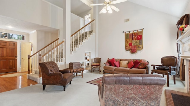 9618 Mystic Crossing Ct, Houston, TX 77065 - living room with high vaulted ceiling, stairway, and a ceiling fan