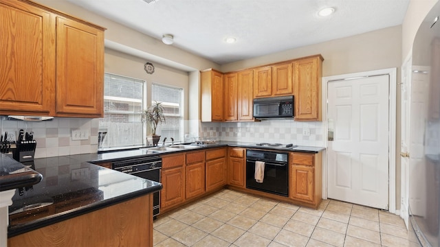 9618 Mystic Crossing Ct, Houston, TX 77065 - kitchen with black appliances, tasteful backsplash, a sink, light tile patterned flooring, and recessed lighting