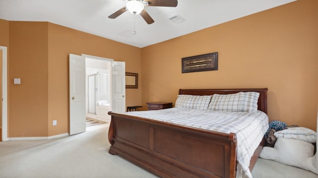 9618 Mystic Crossing Ct, Houston, TX 77065 - bedroom with light colored carpet, baseboards, connected bathroom, and a ceiling fan