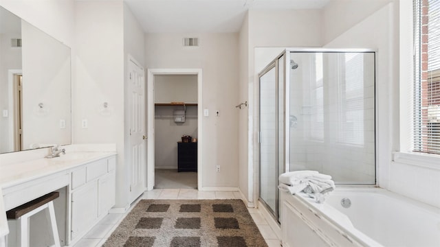 9618 Mystic Crossing Ct, Houston, TX 77065 - full bathroom with a shower stall, vanity, a garden tub, and tile patterned floors