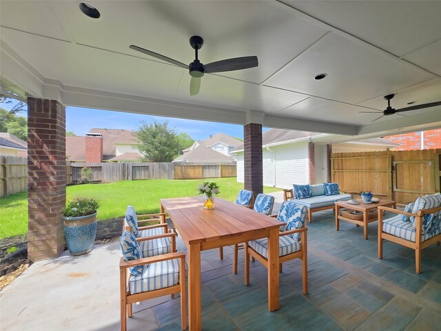 view of patio / terrace featuring ceiling fan, outdoor dining area, and an outdoor living space