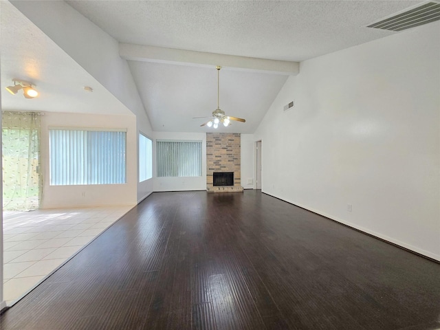 2922 Whetrock Ln, Sugar Land, TX 77479 - unfurnished living room with ceiling fan, a fireplace, beam ceiling, high vaulted ceiling, and wood finished floors