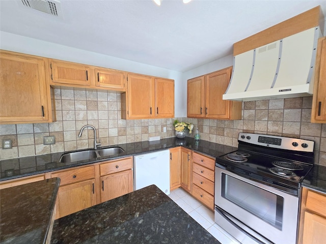 2922 Whetrock Ln, Sugar Land, TX 77479 - kitchen with stainless steel electric stove, white dishwasher, a sink, range hood, and dark stone counters