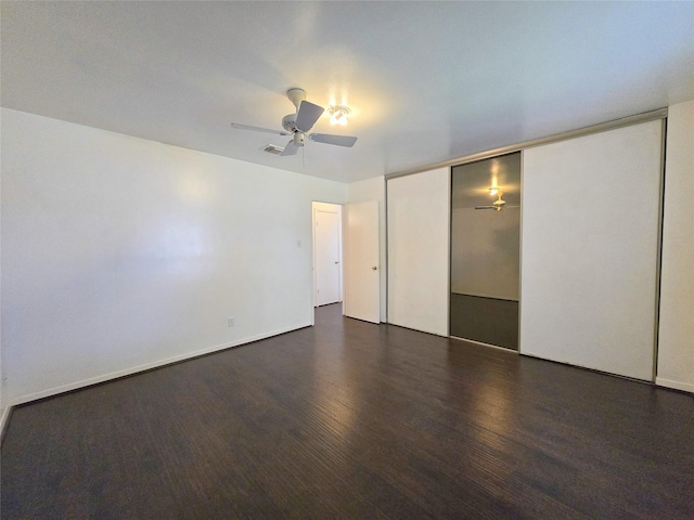 2922 Whetrock Ln, Sugar Land, TX 77479 - unfurnished bedroom with wood finished floors, a closet, and a ceiling fan