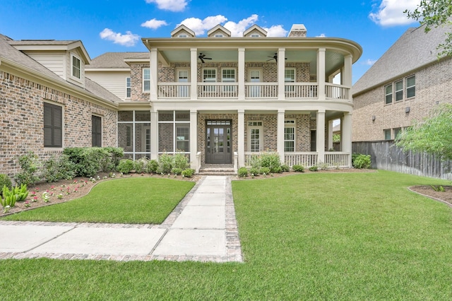 2331 Bottlebrush Ln, Conroe, TX 77384 - rear view of house featuring a balcony, brick siding, a ceiling fan, and a porch