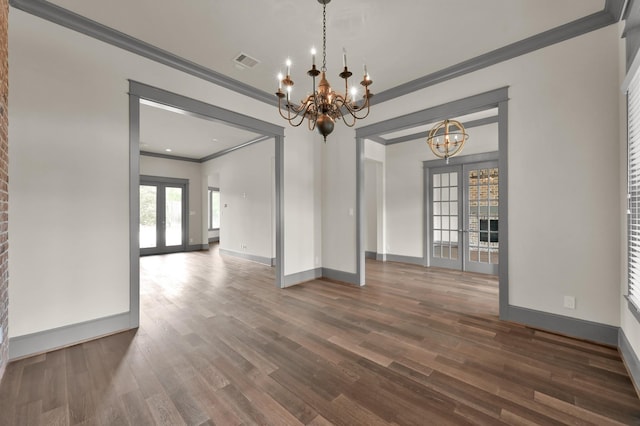 2331 Bottlebrush Ln, Conroe, TX 77384 - unfurnished dining area with ornamental molding, french doors, a chandelier, baseboards, and dark wood-type flooring
