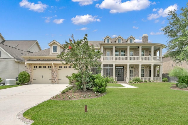 2331 Bottlebrush Ln, Conroe, TX 77384 - view of front facade with brick siding, a porch, a balcony, an attached garage, and driveway