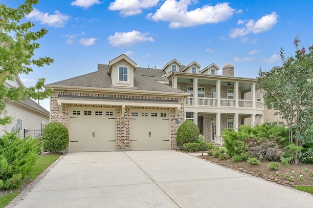 2331 Bottlebrush Ln, Conroe, TX 77384 - view of front of property with brick siding, a balcony, driveway, and a garage