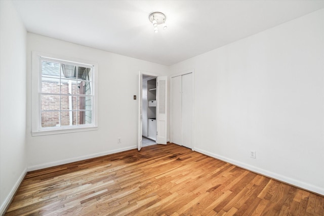 2740 Suffolk Dr, Houston, TX 77027 - unfurnished bedroom featuring wood finished floors, baseboards, and a closet