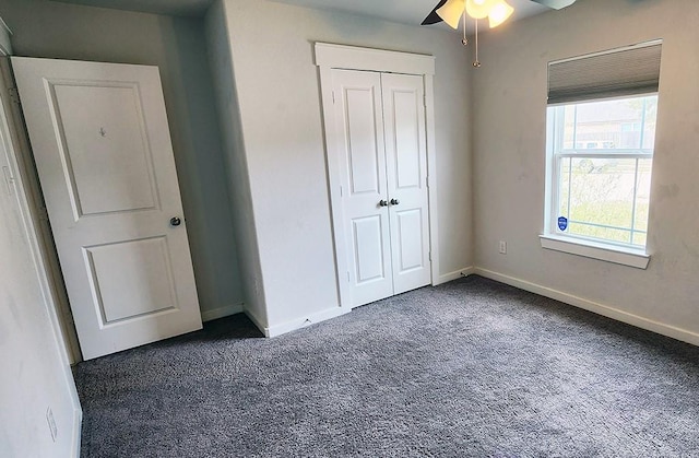 16342 Rockdale Landing Dr, Hockley, TX 77447 - unfurnished bedroom featuring carpet flooring, baseboards, a closet, and a ceiling fan